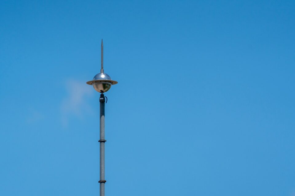 Lightning rod installed on building rooftop in Dedham, MA by Boston Lightning Rod Company, Inc.