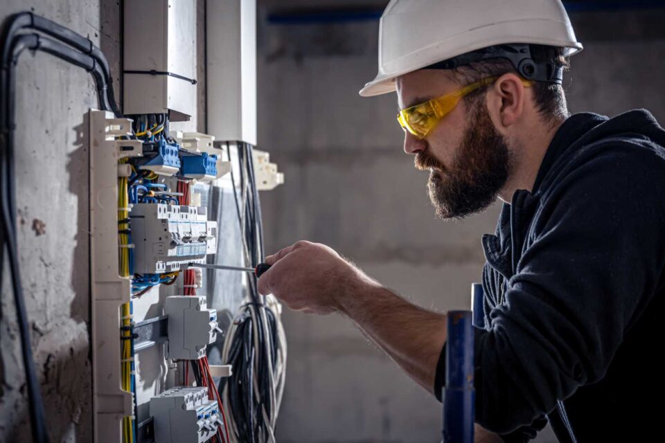 Boston Lightning Rod Co. Inc. technician repairing electrical wiring panel