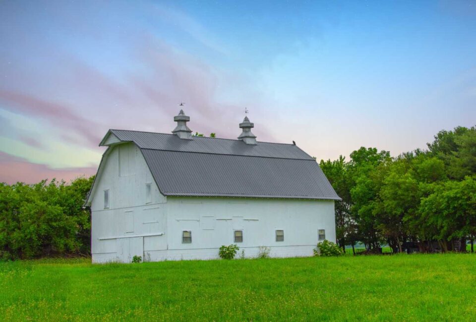 White barn protected with lightning system by Boston Lightning Rod Co. Inc.